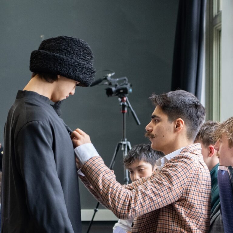 students preparing for a photoshoot