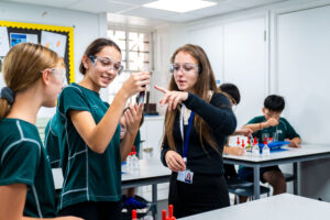 students looking at test tubes