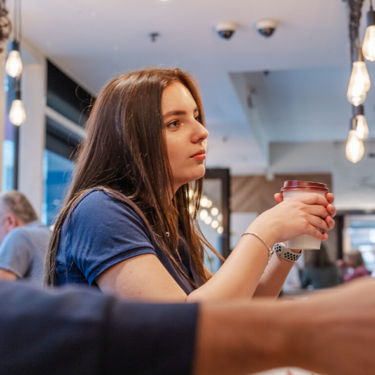 student drinking coffee