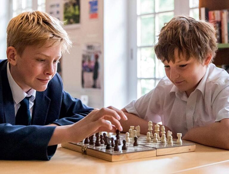 2 boys playing chess