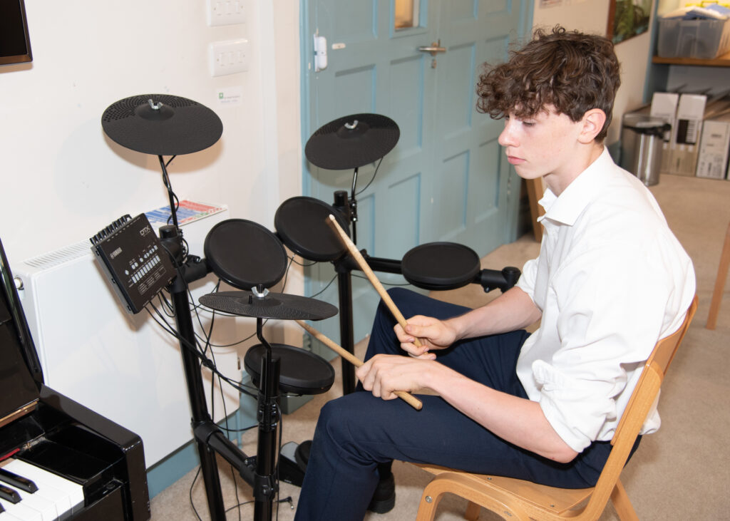 boy playing electric drums