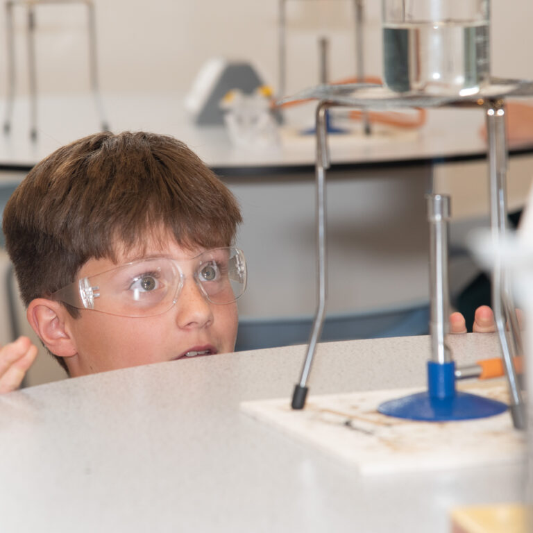 student watching a science experiment